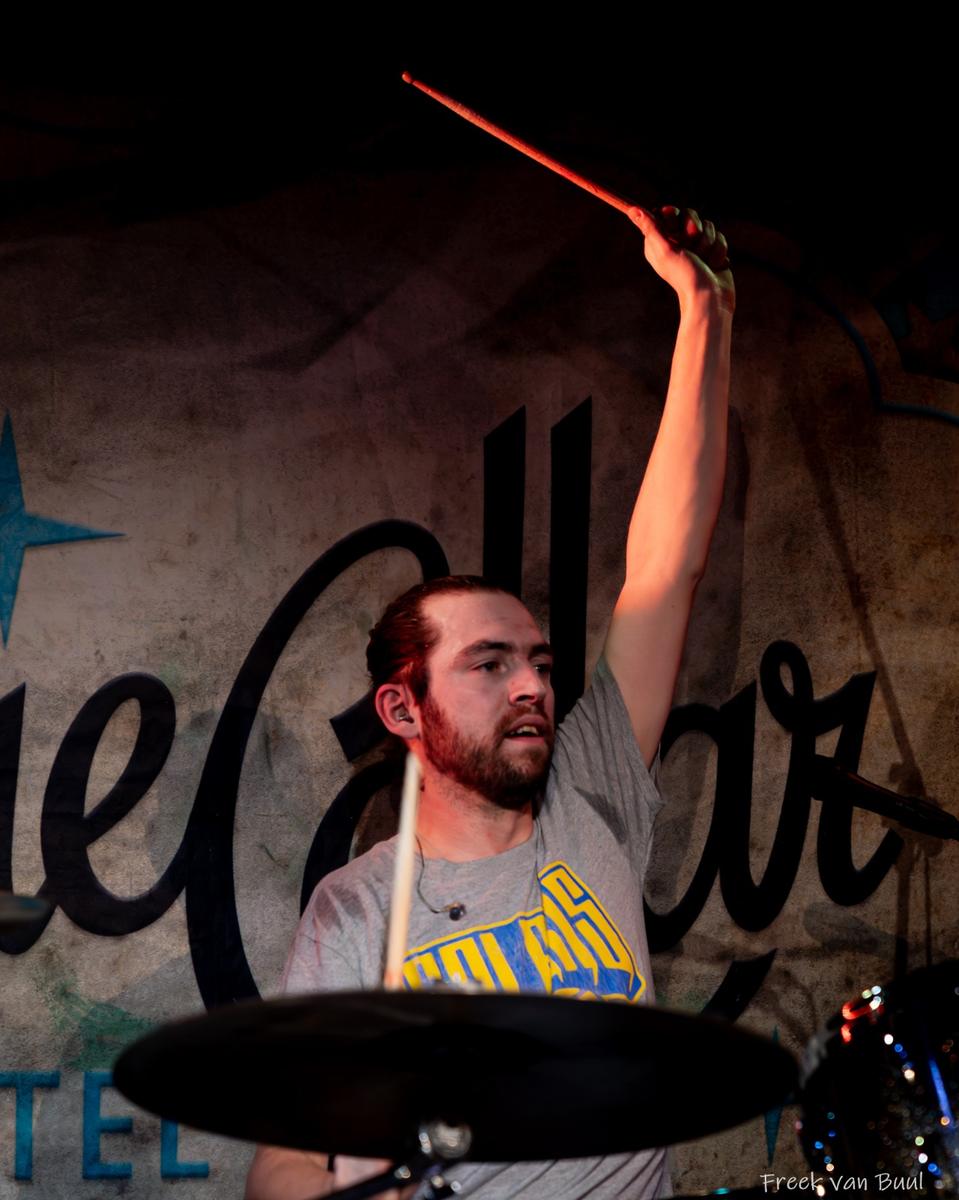 Drummer raising a drumstick